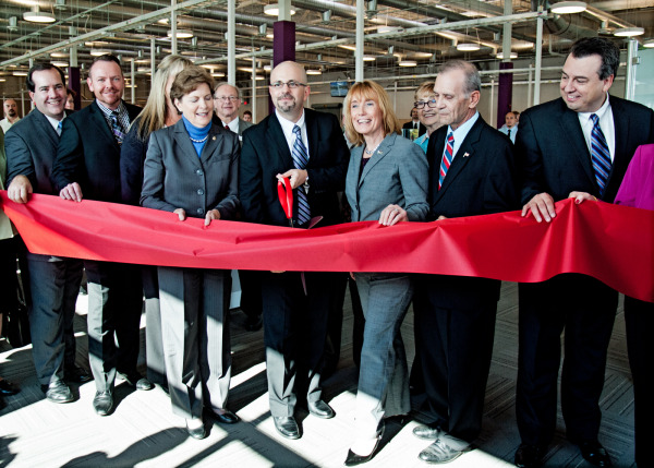 Dignitaries cut the ribbon at Comcast's new call center in Hudson.